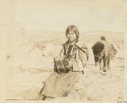 Image of Eskimo [Inuk] girl playing accordion [Mary Napatchee]